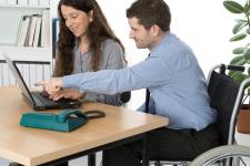 photos of man and woman working on a computer